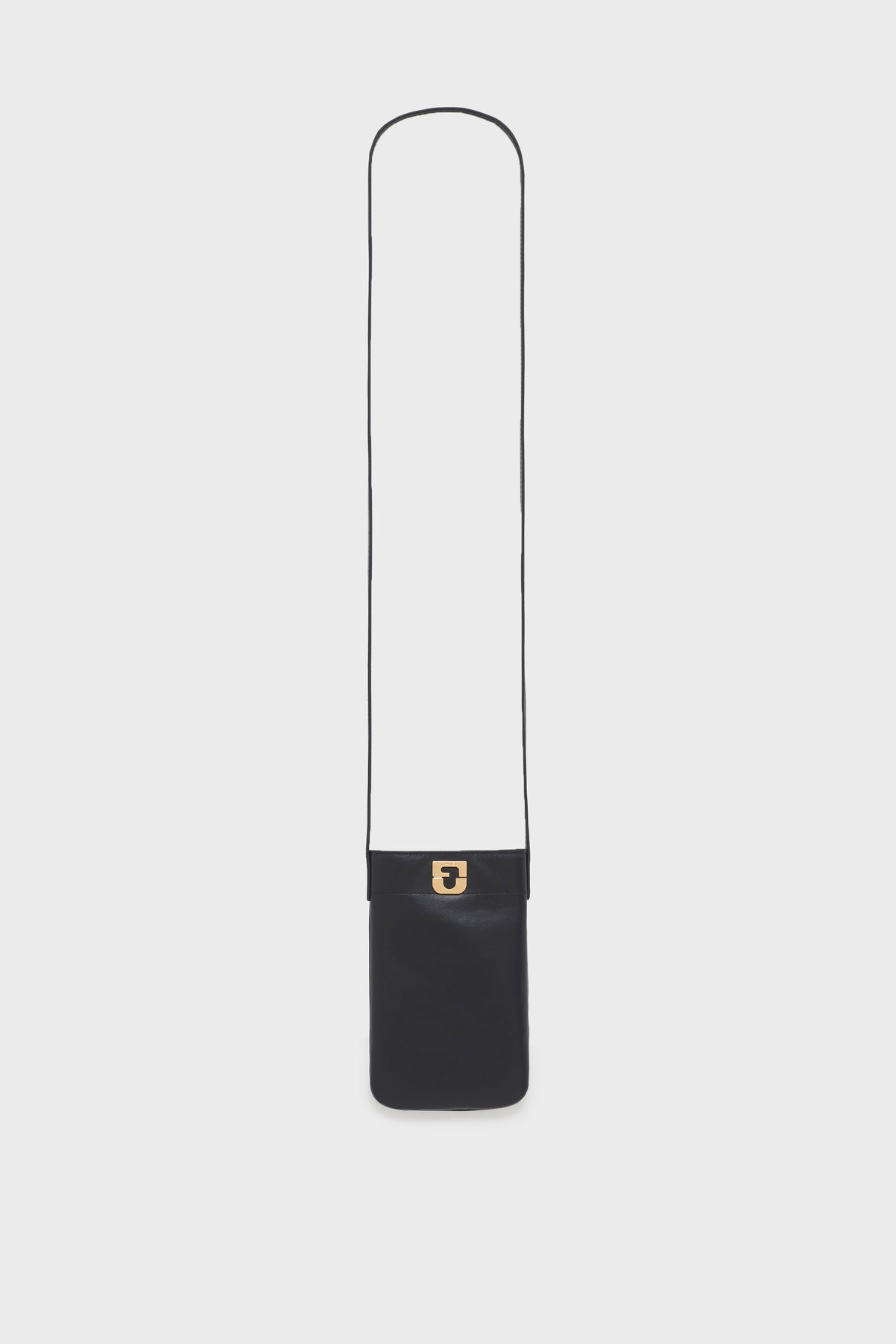 A small, rectangular black porte-téléphone cuir crossbody bag with a long thin strap and a gold clasp, displayed against a plain white background—an accessoire tendance perfect for carrying your essentials in style.