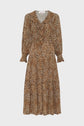 A long-sleeved, mid-length robe léopard with a brown and black leopard print, featuring a ruffled V-neck collar and ruffled cuffs.