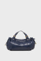 A navy blue leather sac à main cuir by Vanessa Bruno with gold hardware, short handles, and ruched side details, displayed against a plain white background.