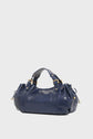 A shiny navy blue leather handbag, reminiscent of the iconic Vanessa Bruno sac à main cuir, with short handles, gold hardware, and side drawstring details, set against a plain white background.