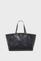 Black leather tote bag with two handles featuring gold buckle accents, reminiscent of a sac inspiration 70’s, shown against a plain white background.