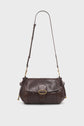A dark brown leather sac bandoulière with a flap closure, gold buckle detail, and an adjustable shoulder strap. The bag has a classic, structured design and gold hardware accents.