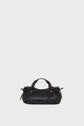 A small black cuir grainé leather mini sac à main with short handles, gold-tone hardware, and decorative side drawstrings, displayed against a plain light gray background.