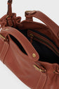 Brown leather sac à main with gold hardware, open to show a black fabric-lined interior and a zippered pocket. This chic it-bag 24H features double handles and visible stitching details, crafted from premium cuir for timeless elegance.