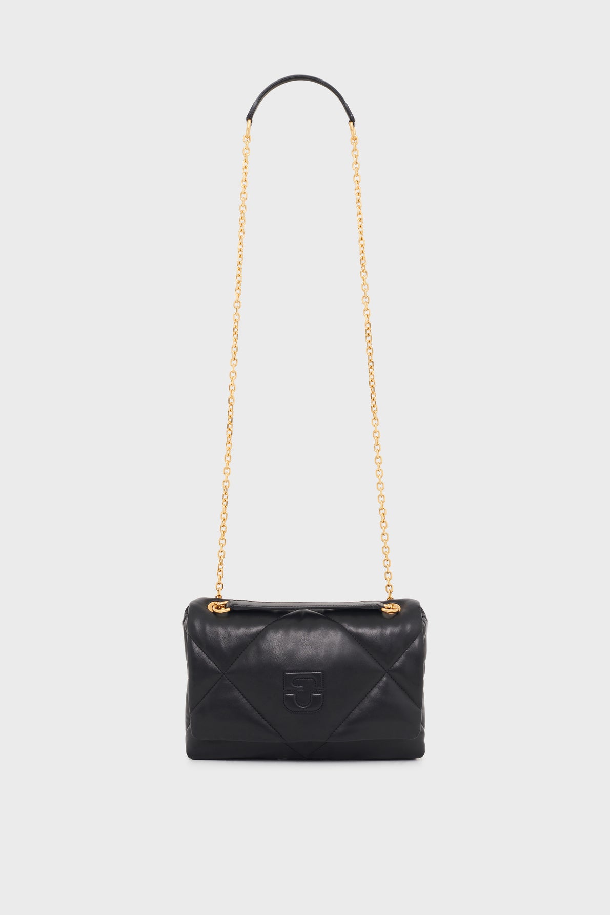 A black quilted cuir d’agneau leather handbag with a gold chain strap and a subtle embossed logo on the front, this sac bandoulière is elegantly displayed against a plain white background.