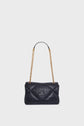 A black quilted sac bandoulière in luxurious cuir d’agneau, featuring a gold chain strap and a raised logo on the front, displayed against a plain white background.