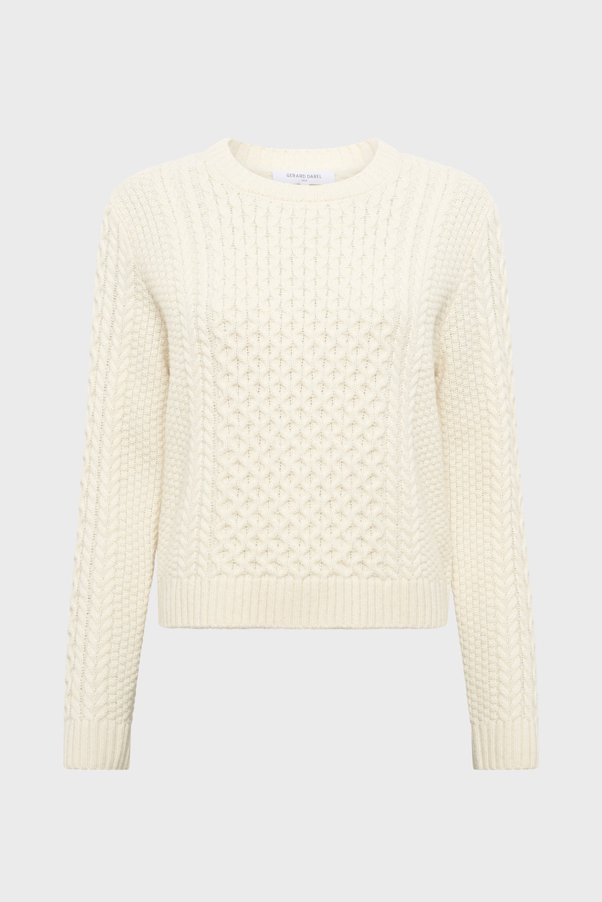 A cream-colored, long-sleeve, cable-knit pull écru with a round neckline and subtle motifs géométriques, displayed on a plain white background.