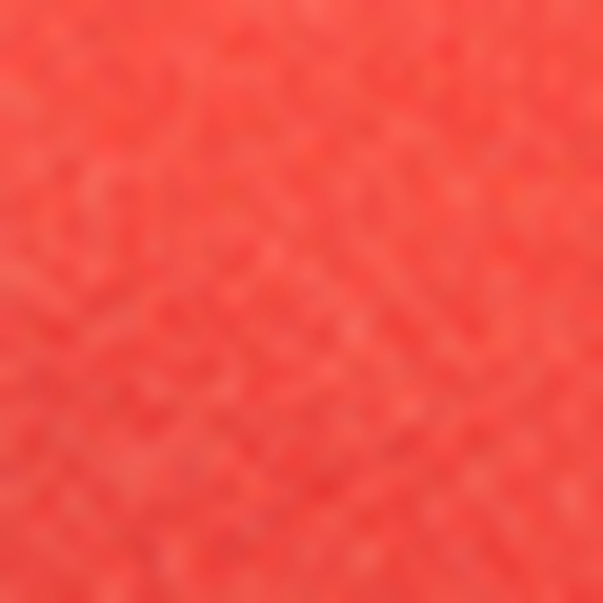 A blurred, textured surface in a solid coral or reddish-orange color fills the entire image, reminiscent of a luxuriously soft laine mélangée or the bold vibrance of rouge baiser.