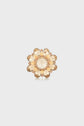 A gold-tone flower-shaped ring with faceted, light amber-colored gemstones arranged as petals and a large central stone evokes the elegant charm of a broche florale, set against a plain white background.