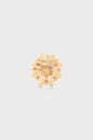 Gold flower-shaped brooch with textured petals and small clear gemstones. This elegant broche florale features a horizontal pin clasp at the back and is displayed on a plain light gray background.