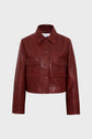 A cropped, long-sleeve, dark red leather jacket with a collar, front buttons, and two chest pockets, displayed on a plain light gray background.