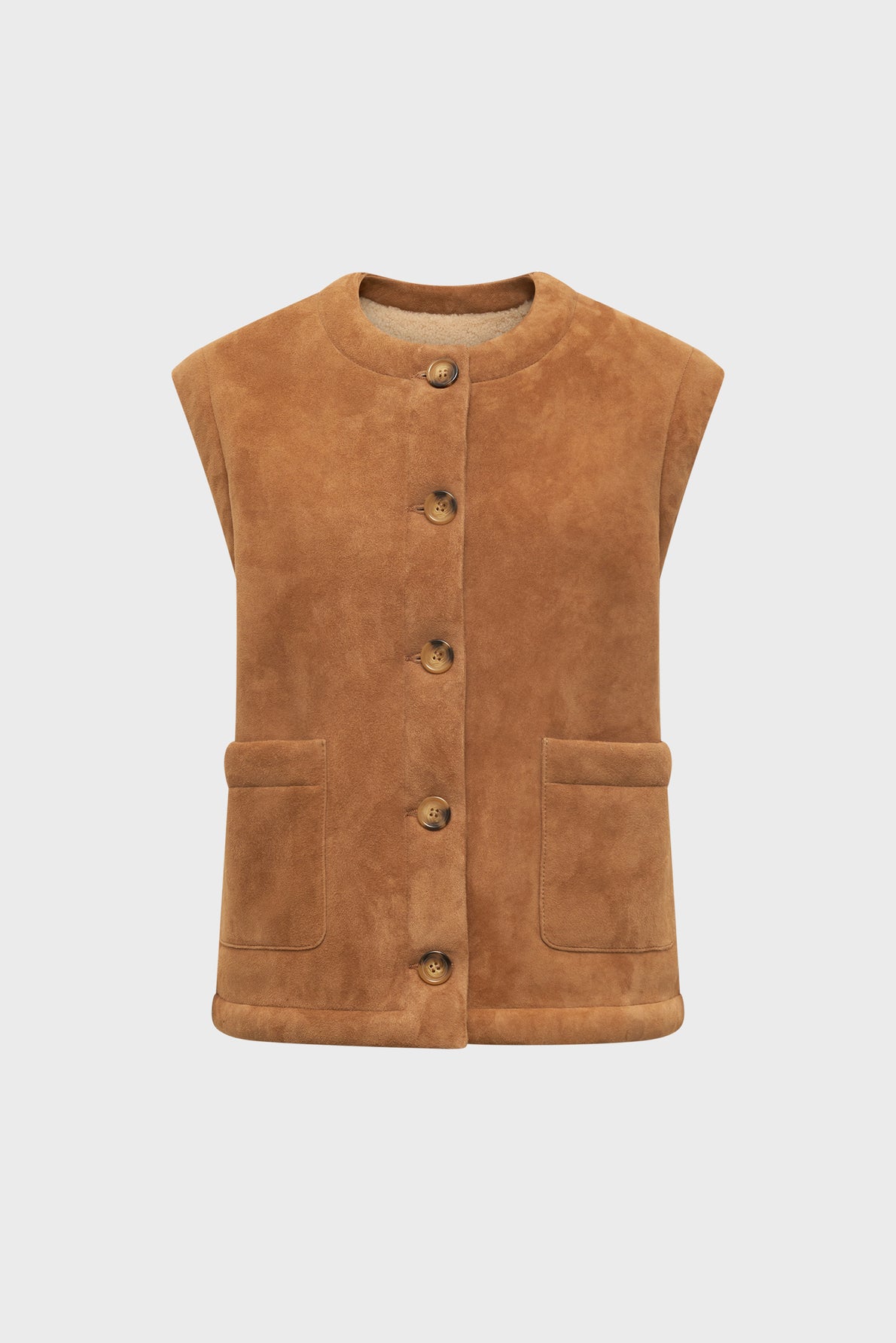 Brown suede vest with a round neckline, five front buttons, and two front pockets crafted in luxurious cuir d’agneau, displayed against a plain white background.
