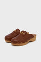 Brown leather sabots cognac with talon bois wooden soles, gold stud detailing around the base, and elegant mors siglés gold chain embellishments on the top, displayed on a plain white background.