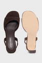 A pair of dark brown sandales cuir velours open-toe sandals, one showing the top view with GERARD DAREL on the insole, and the other showing the tan sole, both with thin heel straps.