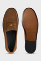 A pair of brown suede loafers, or mocassins cuir velours, shown from above and below, featuring a penny slot detail on the top and a smooth leather sole with non-slip traction at the heel and toe—perfect chaussures casual chic for effortlessly refined style.