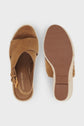 A pair of brown suede sandals with crisscross straps. One sandal shows the top view, and the other shows the sole and heel. Brand name Gerard Darel is visible inside the shoe and on the bottom.