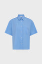 A short-sleeve, button-up sky blue shirt with a left chest pocket, this chemise manches courtes is displayed on a plain white background.