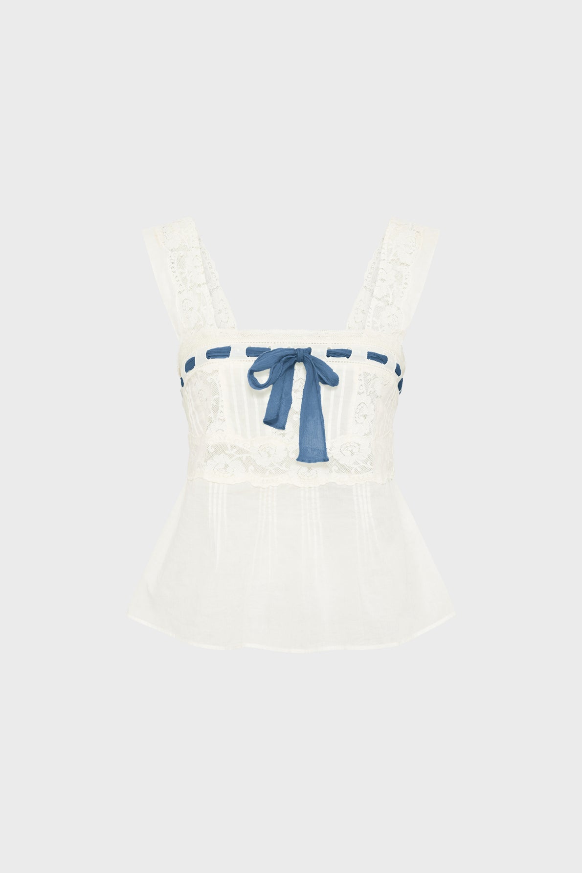 Sleeveless white lace top dentelle with wide straps, a square neckline, and a blue ribbon threaded through the top edge, tied in a bow at the center. Reminiscent of classic esprit lingerie styles, the fabric is slightly sheer and the hem is gently flared.