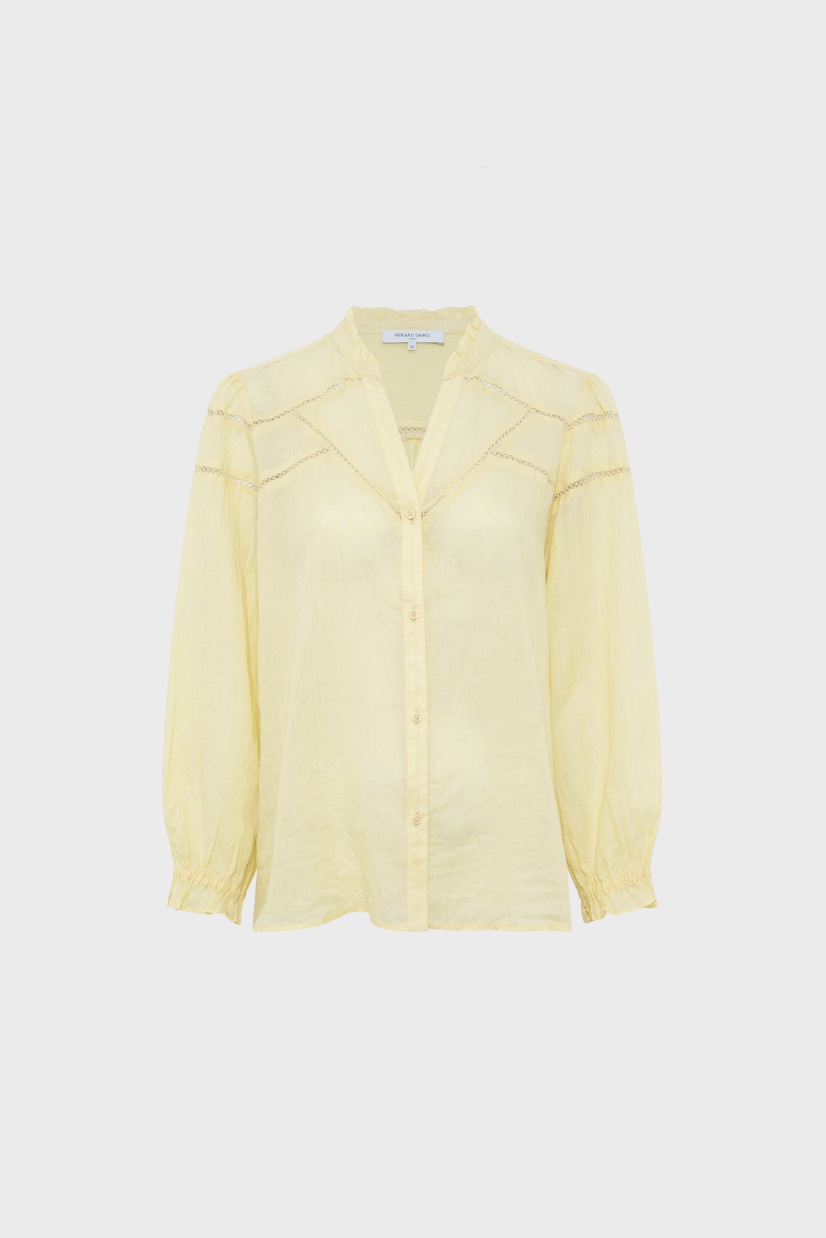 Light yellow long-sleeve chemise brodée with a v-neck, front buttons, subtle lace trim on the chest and shoulders, and elastic cuffs, crafted from tissu fin ramie and displayed on a plain white background.