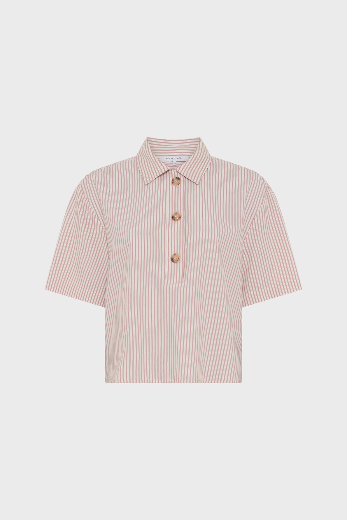 A short-sleeve shirt with a collar, featuring light beige and white vertical stripes for a classic chemise rayée look. Designed in a coupe ample fit, this shirt has three brown buttons down the front and is displayed against a plain white background.