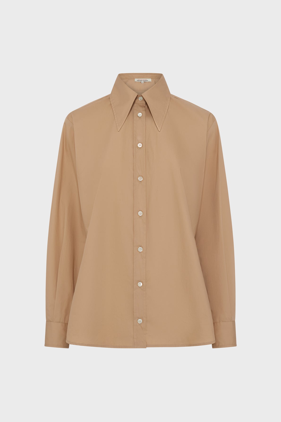 A beige long-sleeve button-up chemise coton with a pointed collar and white buttons, displayed on a plain white background.