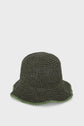 A dark green, crocheted bucket hat reminiscent of a classic chapeau kaki, with a wavy brim featuring a lighter green edging, displayed against a plain white background.