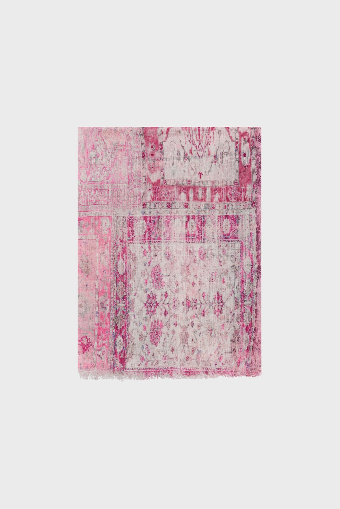 A rectangular, vintage-style rug with faded pink, magenta, and white patterns on a light background, featuring floral and geometric designs reminiscent of a foulard Daisy.