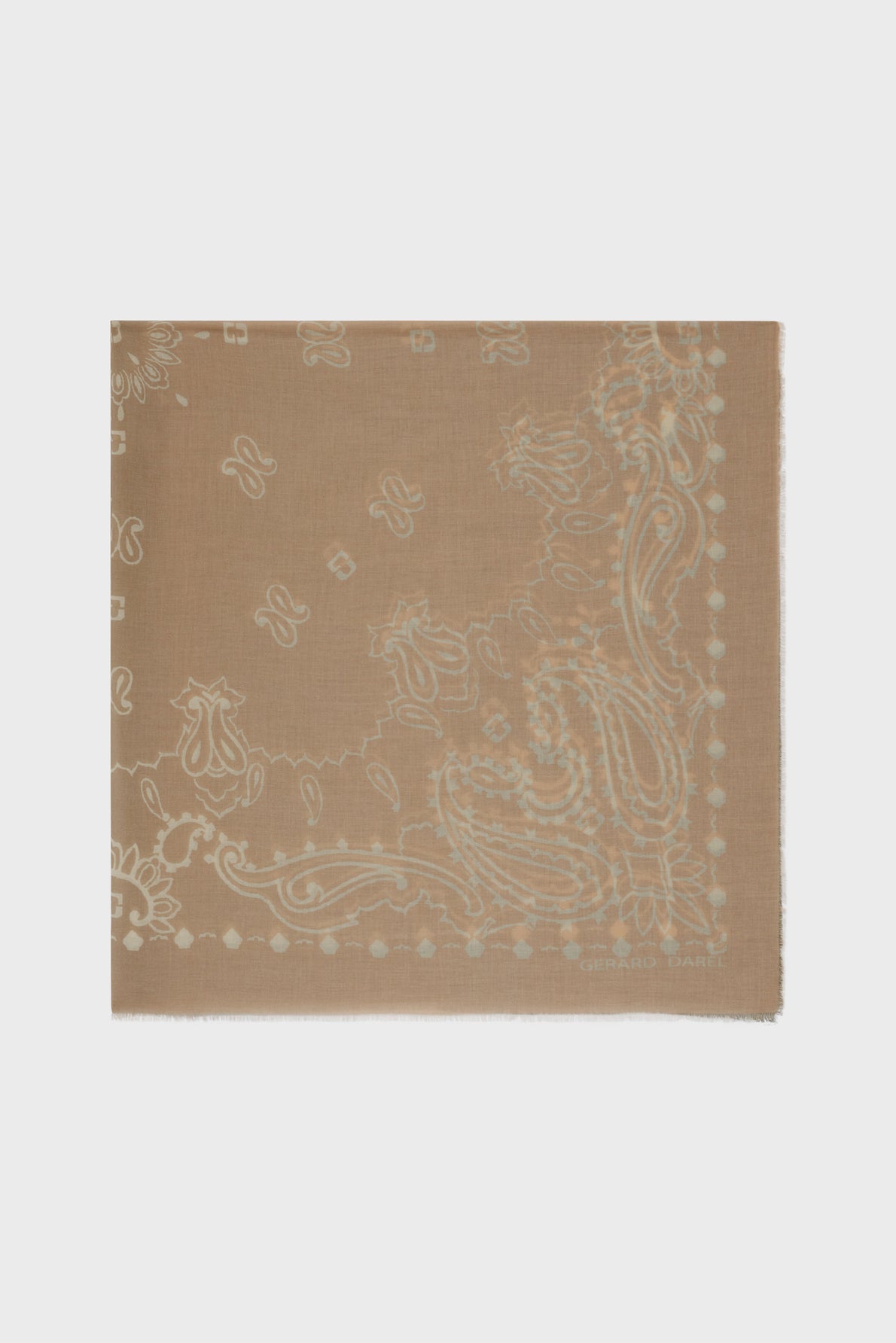 A light brown carré coton square scarf with a subtle paisley and floral pattern in a lighter shade, set against a plain white background.