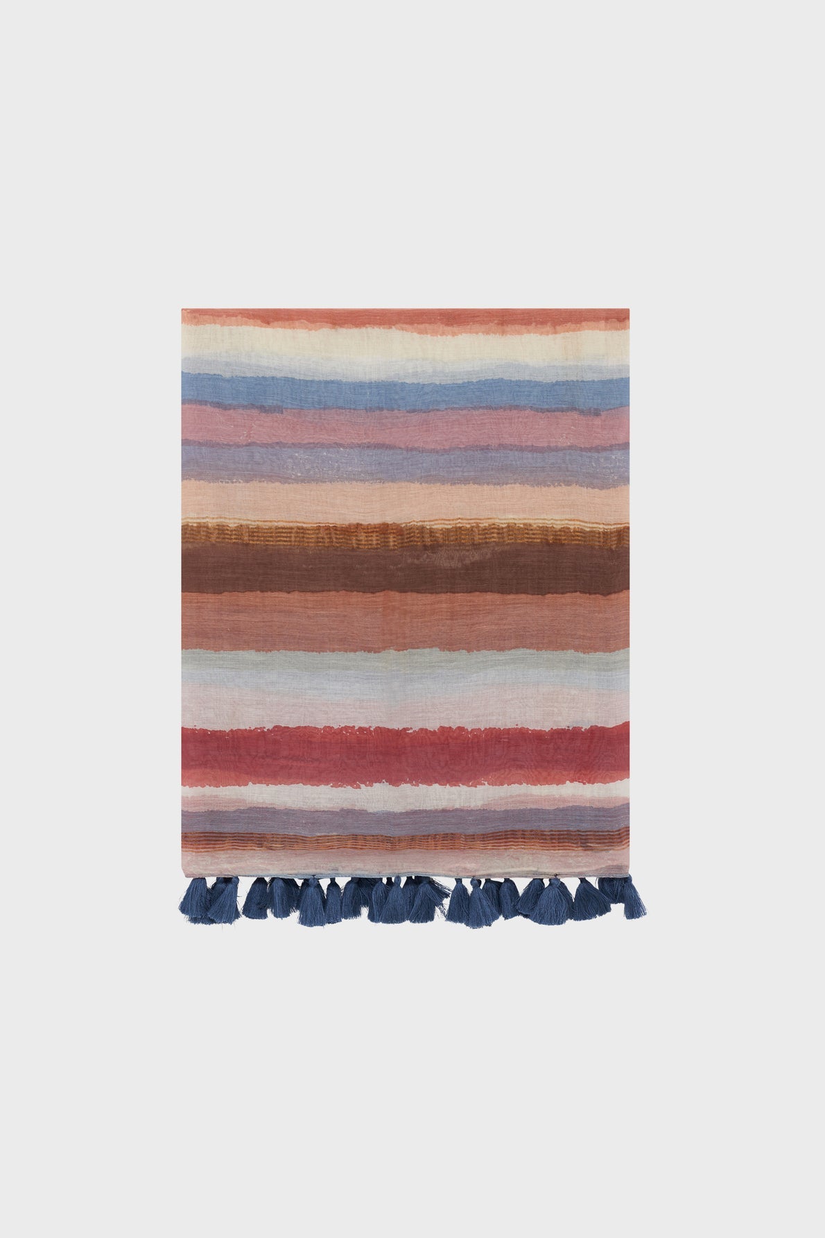 A folded étole rayée with horizontal stripes in shades of blue, pink, red, and brown, featuring dark blue tassels along the bottom edge.