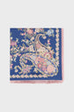 A blue carré en soie square scarf with pink fringe, featuring an intricate motif floral and paisley pattern in pink, yellow, green, blue, and cream tones.