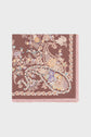 A carré en soie with a mauve background, featuring an intricate motif floral and paisley pattern in soft pink, yellow, and blue tones, and finished with a light pink fringe border.