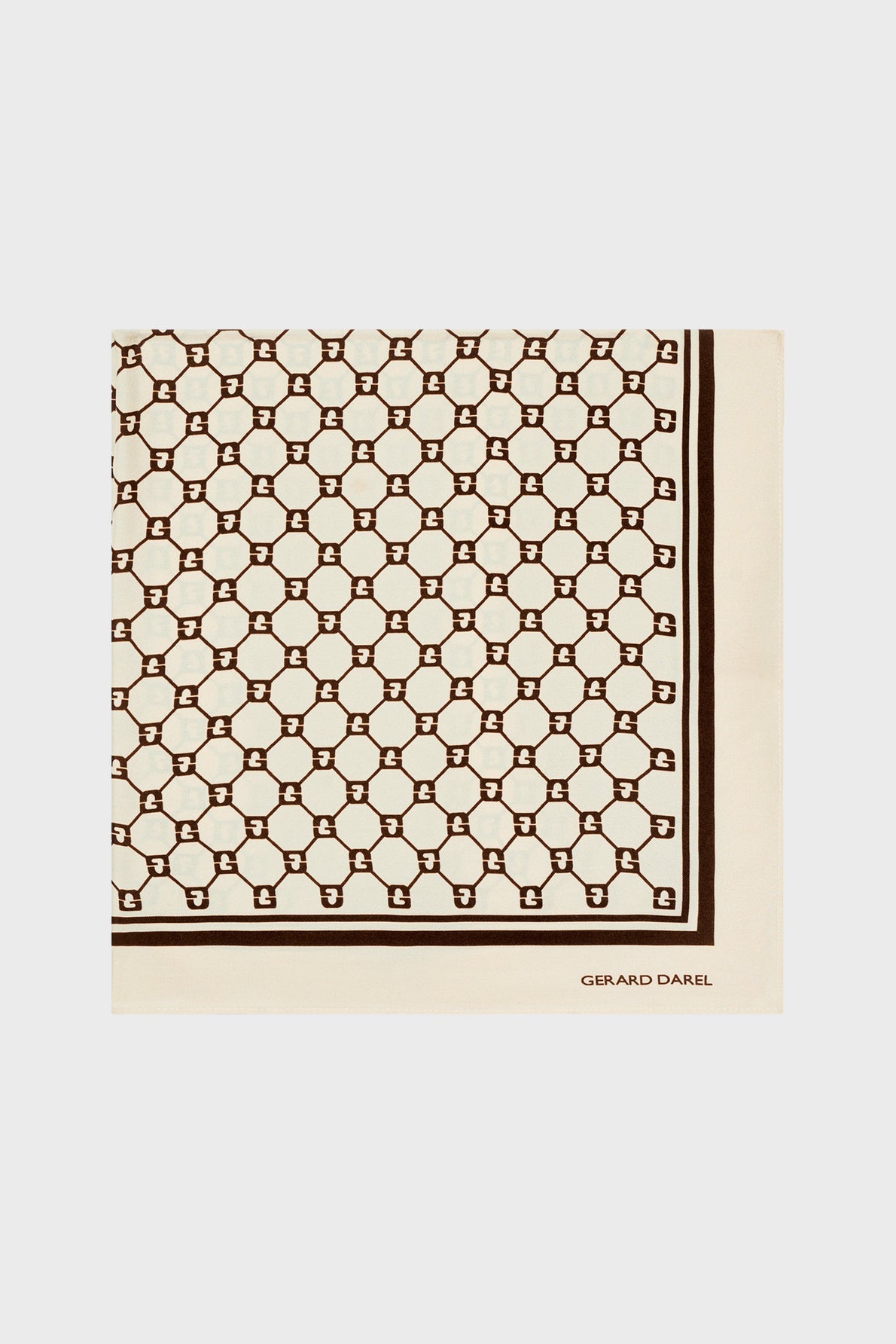 Cream-colored carré soie scarf with a repeating brown geometric pattern and a solid border. The iconic monogramme GD is subtly integrated into the design, while the brand name GERARD DAREL is printed in the lower right corner.