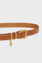 A tan leather belt with a gold buckle and a small gold charm hanging from a loop near the buckle, this ceinture élégante by Gerard Darel is displayed on a white background.
