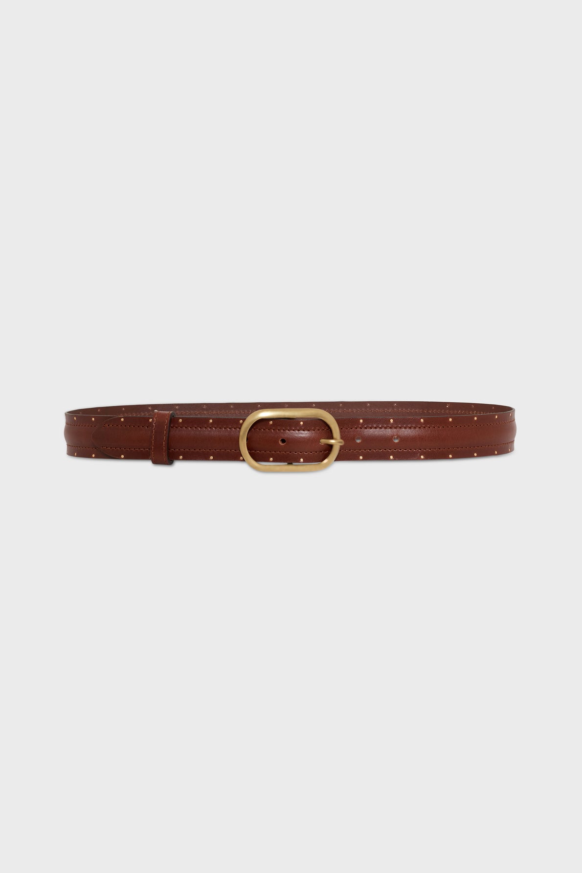 Brown leather belt with small perforated holes and a gold oval buckle, displayed against a plain white background—a ceinture élégante that blends timeless style with modernity.