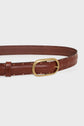 A brown ceinture cuir with small gold studs and a rounded gold buckle, photographed on a white background, this accessory seamlessly blends élégance and modernité for any ensemble.