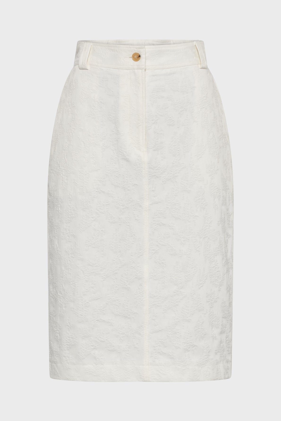 White knee-length pencil skirt with a subtle floral textured pattern, front button and zip closure, belt loops, and a tailored fit. The background is plain and light-colored.