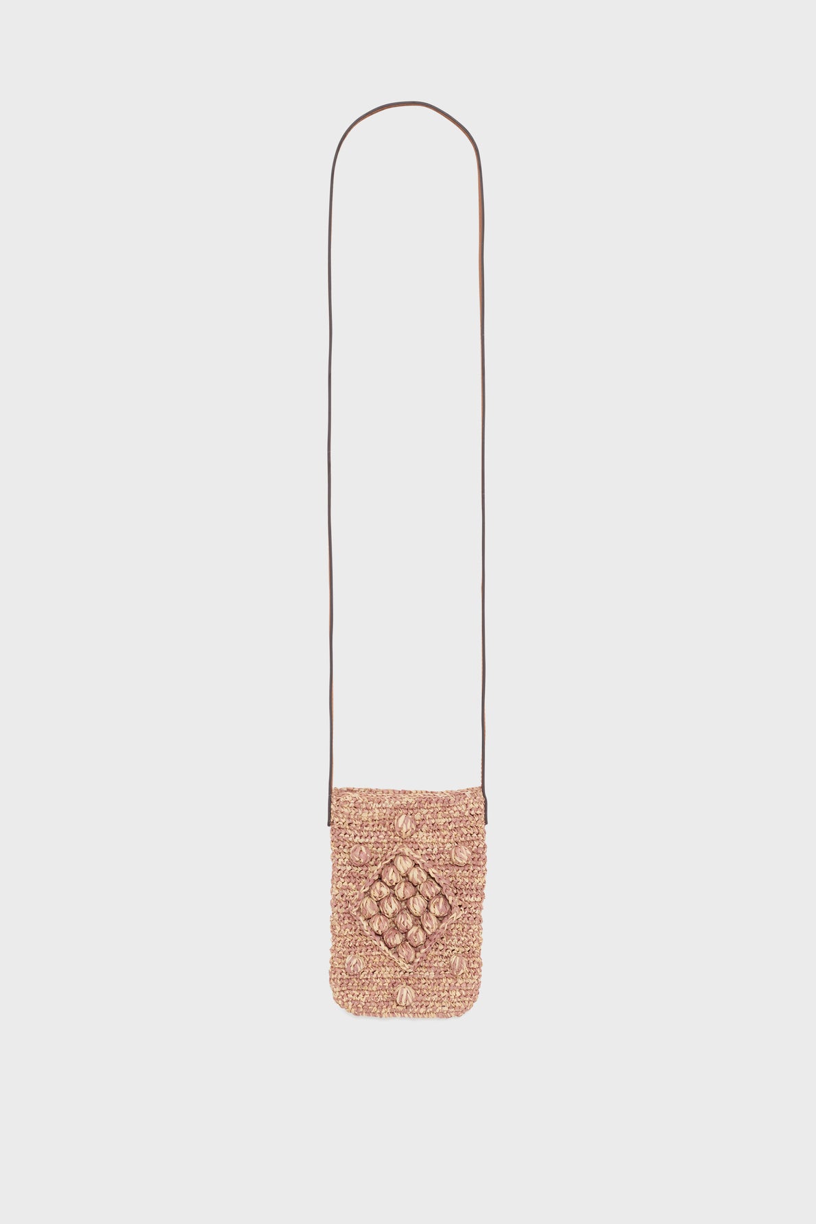A small, rectangular, woven raphia straw crossbody bag with a long, thin brown cuir strap and a raised diamond pattern on the front, displayed against a plain white background—perfect as an elegant porte-téléphone for your essentials.