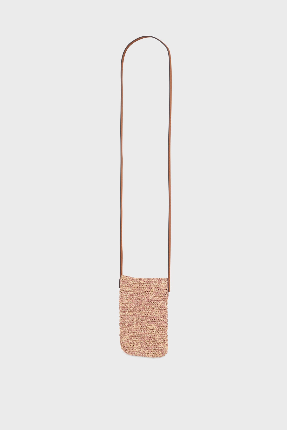 A small porte-téléphone crossbody bag with a woven, textured raphia body in light brown and a long, thin cuir leather strap, displayed against a plain white background.