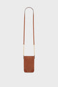 Brown suede crossbody bag with a long strap and small gold chain details. This elegant cuir velours accessory features a rectangular shape with rounded leather corners, a minimal design, and practical bandoulière chaîne—perfect as a chic porte-téléphone. Displayed against a plain white background.