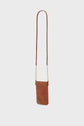 Small brown cuir velours crossbody bag with a long leather strap and elegant bandoulière chaîne gold accents, displayed against a plain white background.