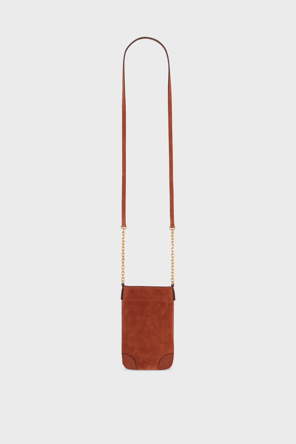 Small brown cuir velours crossbody bag with a long strap and gold bandoulière chaîne details, perfect as a chic porte-téléphone, displayed against a plain white background.