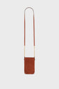 Small brown cuir velours crossbody bag with a long strap and gold bandoulière chaîne details, perfect as a chic porte-téléphone, displayed against a plain white background.