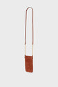 Brown cuir velours crossbody bag with a long leather strap and small, elegant bandoulière chaîne accents connecting the strap to the rectangular bag, displayed on a plain white background.
