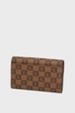 Brown rectangular portefeuille Gerard Darel with a repeating black logo pattern in toile enduite monogrammée, displayed on a plain white background. The accessoire élégant stands upright and slightly angled, showcasing its front and side.