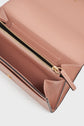 Open blush pink Gerard Darel leather wallet with gold zipper, multiple compartments, and white stitching, shown from above on a white background—an accessoire élégant and portefeuille cuir designed for refined organization.