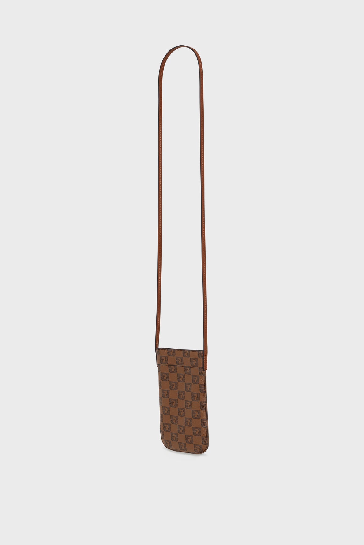 A small brown crossbody bag with a long strap and a checkered pattern featuring a repeating designer logo in toile enduite monogrammée, displayed against a plain white background. This chic porte-téléphone also features a practical fermeture magnétique for secure and easy access.