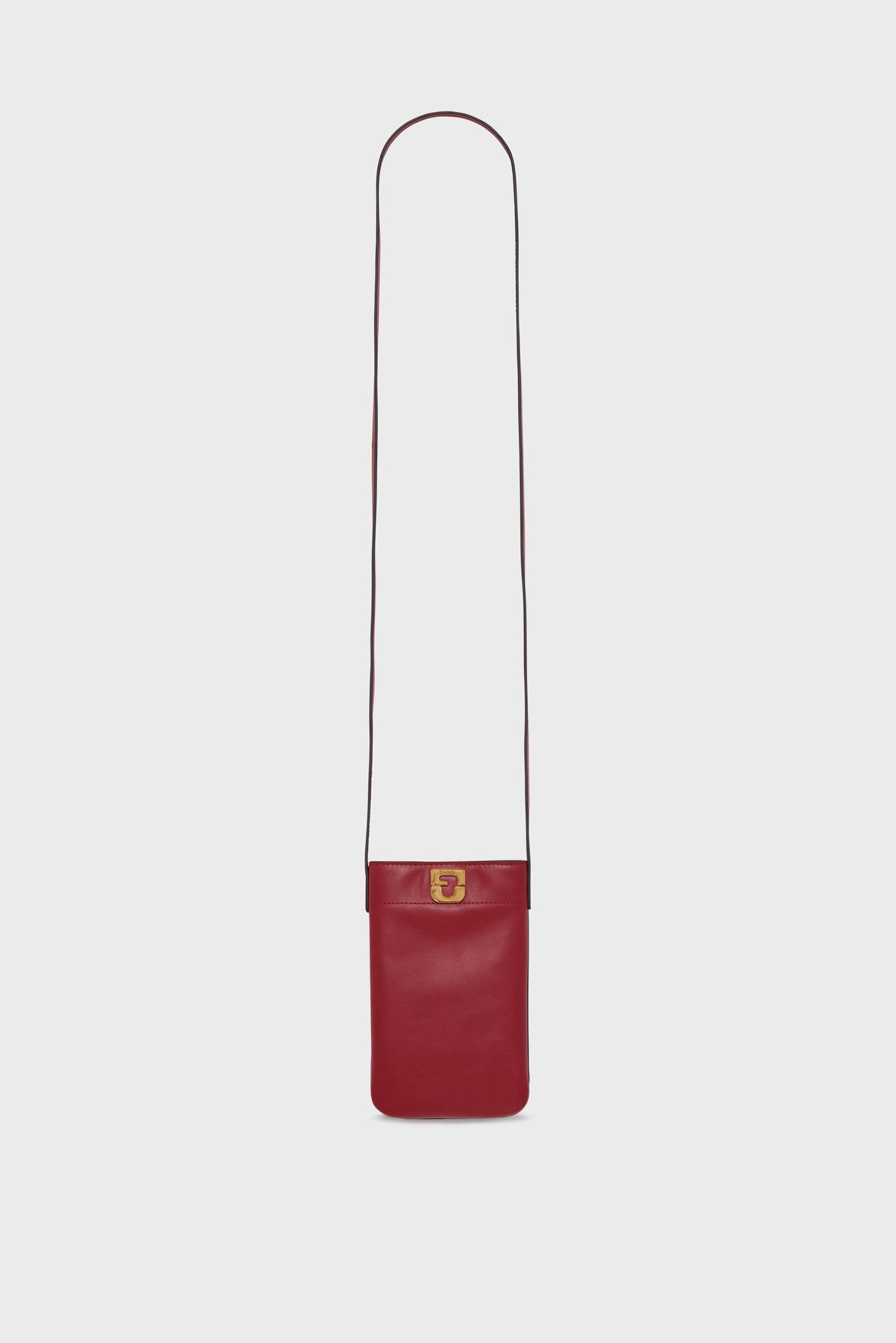 A slim, rectangular sac bandoulière in vibrant red cuir de vachette, this leather crossbody bag features a long strap and a small gold clasp on the front, making it perfect as a chic porte téléphone. Displayed against a plain white background.