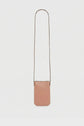 A small, rectangular, tan cuir de vachette leather crossbody bag with a long, thin strap—perfect as an accessoire tendance or porte téléphone—displayed against a plain white background.