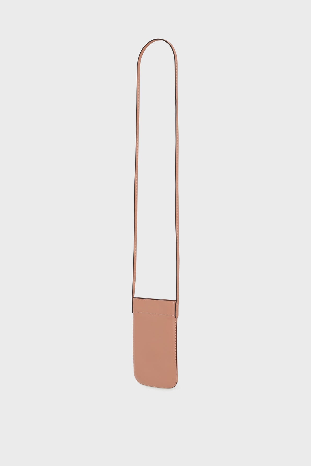 A small, rectangular, light brown leather crossbody bag crafted from cuir de vachette with a long thin strap, perfect as an accessoire tendance for carrying your essentials, is shown against a plain white background.