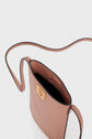 A small, blush pink crossbody bag crafted from cuir de vachette with a long strap, open top, and a gold clasp on the front. This porte téléphone is empty and photographed against a white background—a true accessoire tendance for any modern wardrobe.